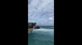 Tourists have white-knuckle boat ride over choppy waves in the Philippines