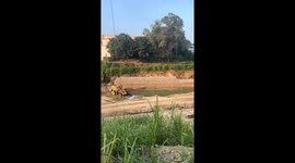 Quick-thinking operator douses burning loader with excavator’s bucket