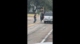 Two Men Spotted Fighting at a Stoplight