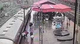 Railway station officer saves two passengers who slip under moving train