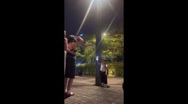 Supportive toddler holds mum's phone to record her dancing video