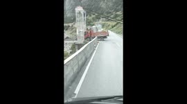 Brave driver takes truck across flimsy-looking suspension bridge in China