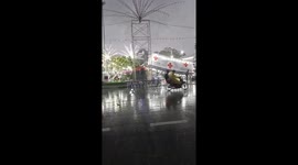 Sign collapses onto festival visitors during storm in Thailand