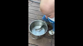 Giggling At Newly Caught Fish