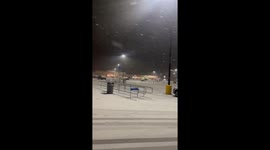 Heavy snow blankets parking lot in Bluefield, West Virginia, USA
