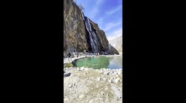 This breathtaking shot captures the mesmerizing Manthokha Waterfall (Kharmang, Baltistan) — one of the most spectacular natural wonders in Gilgit-Baltistan. The image showcases the crystal-clear turquoise pond at the base of the roaring waterfall, reflect