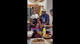 Girl with Down syndrome becomes emotional while pulling money from surprise birthday cake