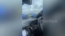 Man seen running into oncoming traffic on M1 chased by police officers