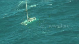 US Coast Guard helicopter rescues five from sinking yacht