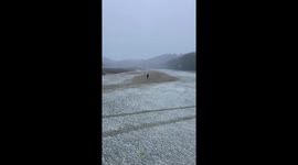 Brief morning snowfall covers golf course in Clarksville, USA