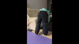 Dog dressed in human-like outfit waddles across hill in Anhui, China