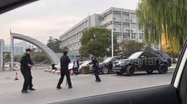 Heroic Range Rover driver rams knife-wielding man as he attacks police outside bank in China
