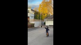 Boy gives thumbs up after funny bicycle mishap in Sweden
