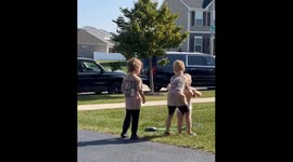 Three brothers enjoy playful launch on toy pump in USA