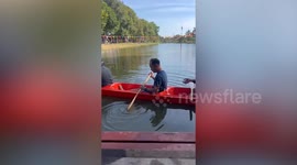 Four men in canoe capsize into water