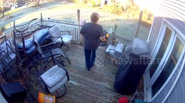Woman slips on front stairs during morning walk in New York, USA