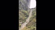Electric car slides down iconic Tianmen Mountain steps crashing into guardrail