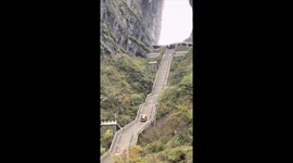 Electric car slides down iconic Tianmen Mountain steps crashing into guardrail