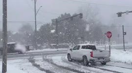Drivers battle through lake-effect snow in La Porte, Indiana