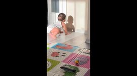 Curious baby mesmerized by shadow in Izmir, Turkey