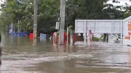 Rescue team surveys village submerged by flood in Thailand