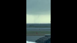 Waterspout tornado forms over sea off Naha Airport in Japan