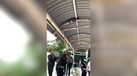 Police catch huge python coiled in metal walkway roof