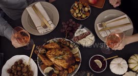 Friends Enjoying a Delicious Thanksgiving Turkey Dinner 4K