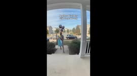 Man trips on front steps while bringing birthday gifts in Waldorf, USA