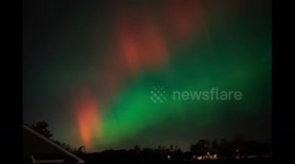 Aurora borealis curtain illuminates Johnston, Iowa, USA