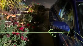 Securing potted palm trees during storm in San Jose, California, USA