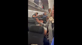 RAW FOOTAGE-'Karen' has fierce argument with plane passengers after rushing for exit