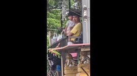 Floodwater surges into village as barrier breaks