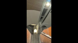 Airport roof leaks causing waterfall inside building during heavy rain in Malaysia