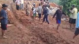 Landslide buries homes killing up to 20 residents in Indonesia