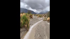 Minor flash flooding rushes through Coyote Canyon in California, USA