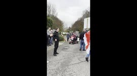 Protesters gather outside a migrant hotel at the Crowne Plaza in West Drayton.
