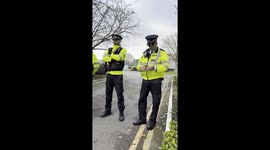 Heavy police presence forms outside the migrant Crowne Plaza Hotel in West Drayton as protesters arrive.