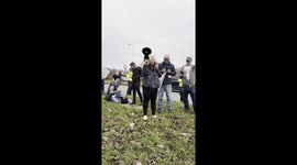 An organiser delivers a passionate speech at a protest against migrant hotels in the West Drayton area.