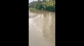 Severe flooding submerges car beneath bridge in Birmingham, UK