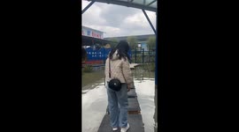 Woman falls into water at moving platform in Henan, China