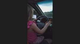 A heartwarming moment captured as our granddaughter, Avery, drives on a quiet back road sitting safely on her Papa's lap. The video shows the fun and instruction shared as she gets a first taste of driving with her grandparents.