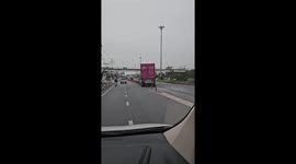 Truck driver caught cutting through row of cones to change lanes