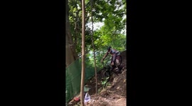 Downhill mountain biker 'presses eject' as he loses control and leaps down hillside