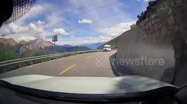Driver narrowly avoids head-on crash on busy mountain road
