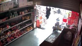 Toddler lifted into air by shop's shutter, family rush to save him