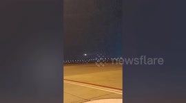 Passengers stunned when plane tyre explodes on runway