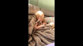 Baby girl snuggles her teddys