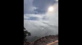 Fog drifts over mountain viewpoint in Prachinburi, Thailand