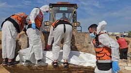 14 unidentified Palestinian bodies buried in Deir al-Balah